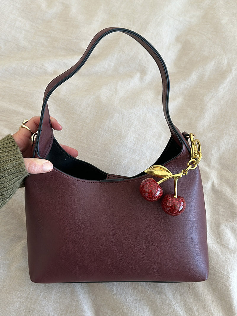 Amelia bag made of artificial leather with a cherry charm