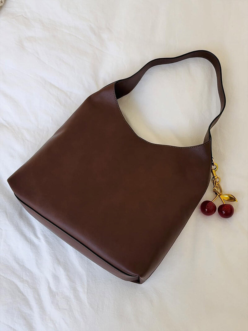 Amelia bag made of artificial leather with a cherry charm